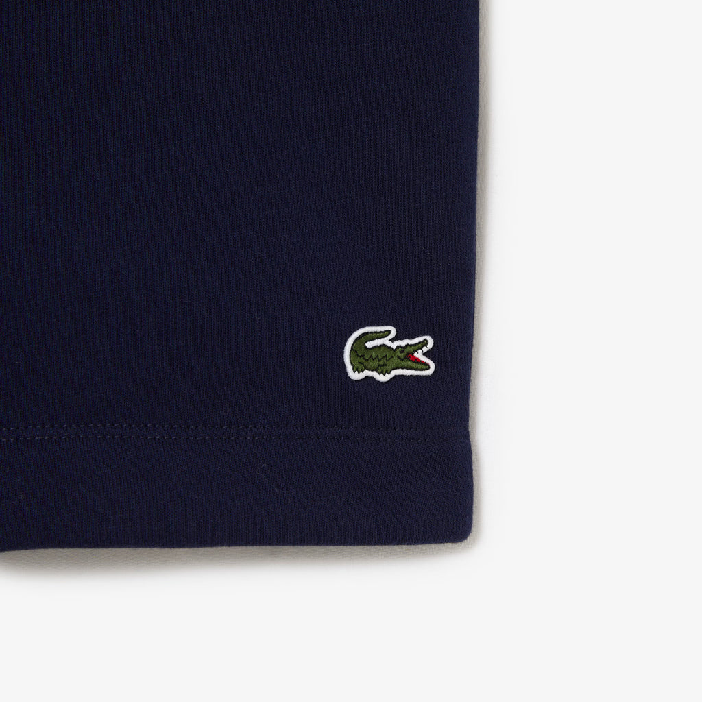 Short Lacoste bleu nuit détail crocodile brodé
