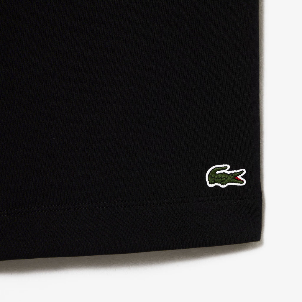 Short Lacoste noir détail tissu coton bio

